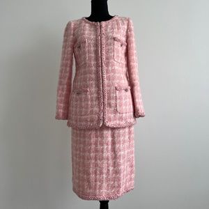 Sold at Auction: A collection of Chanel couture clothing to include a short  buckle jacket with matching skirt (P16222V08834), a collarless red tweed  jacket (P18110V10358), a black & white contrast trim Boucle